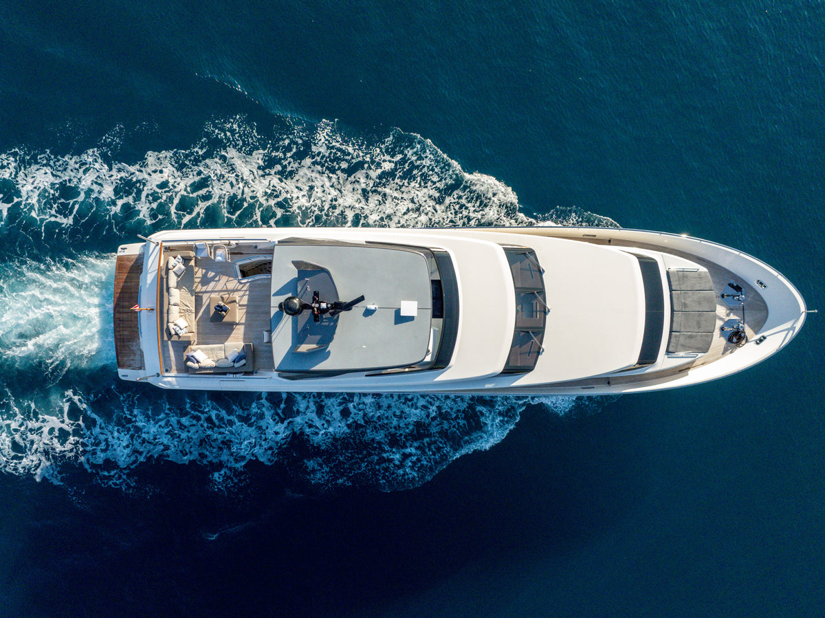 The 97ft Sanlorenzo ASTONISH from the bow quarter, her dark tinted windows and raked profile on show