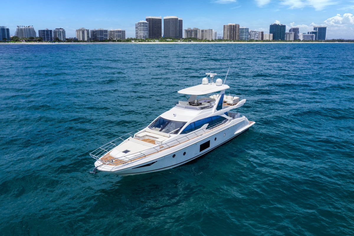 Le Grand Bleu 68ft Azimut yacht anchored in front of the Miami skyline