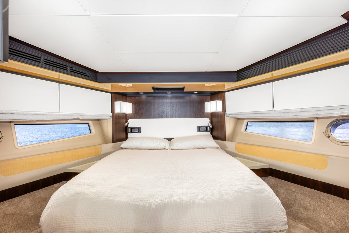 VIP forward cabin on Le Grand Bleu, with a double bed and hull windows on both sides