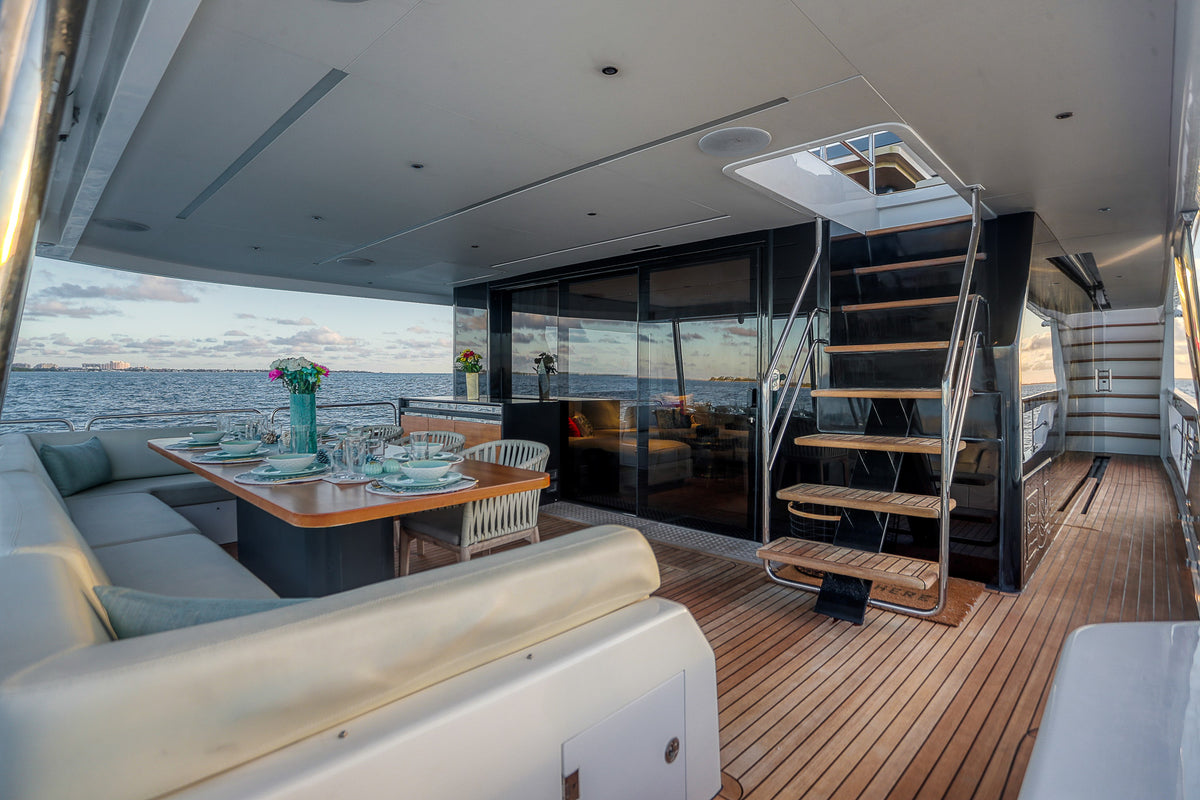 Alfresco dining on the 88ft Sirena SAINT's aft deck, steps from the swim platform