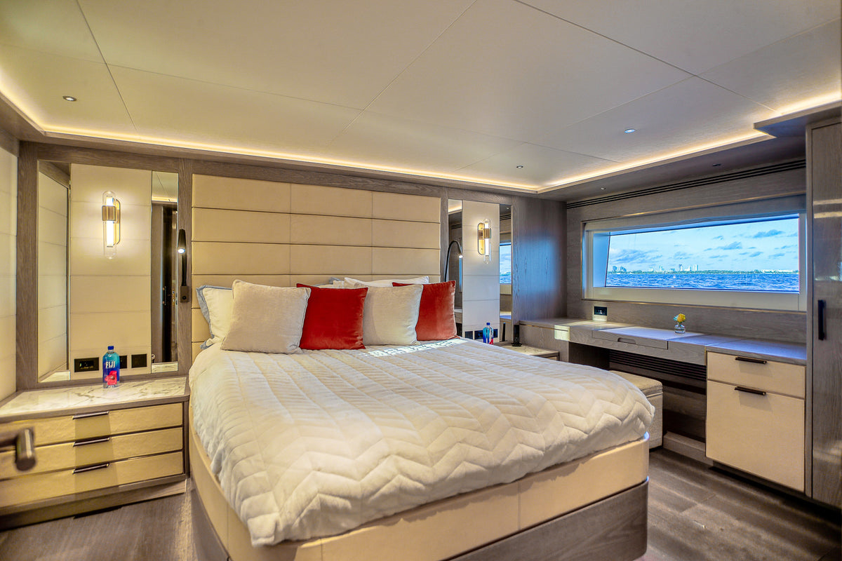 Guest stateroom on SAINT, twin-berth layout finished in pale oak