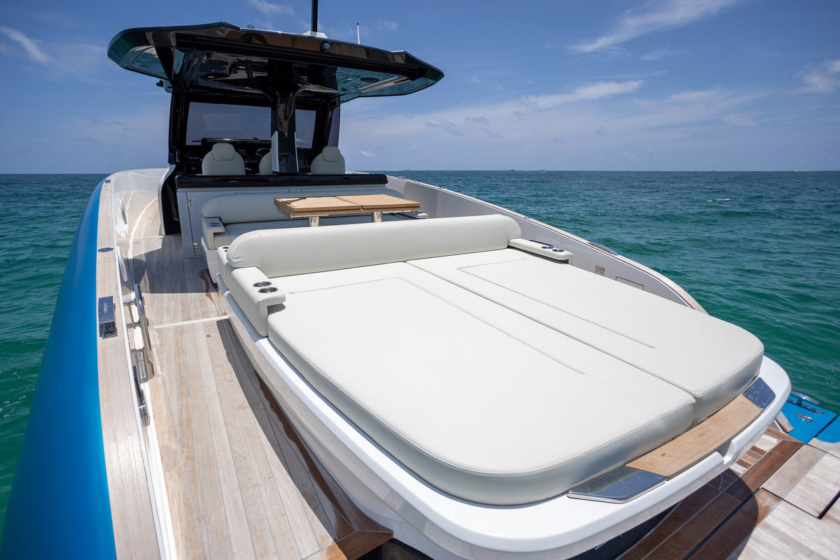 Aft deck of the Solaris Power Sport Turismo with sun pad and teak table