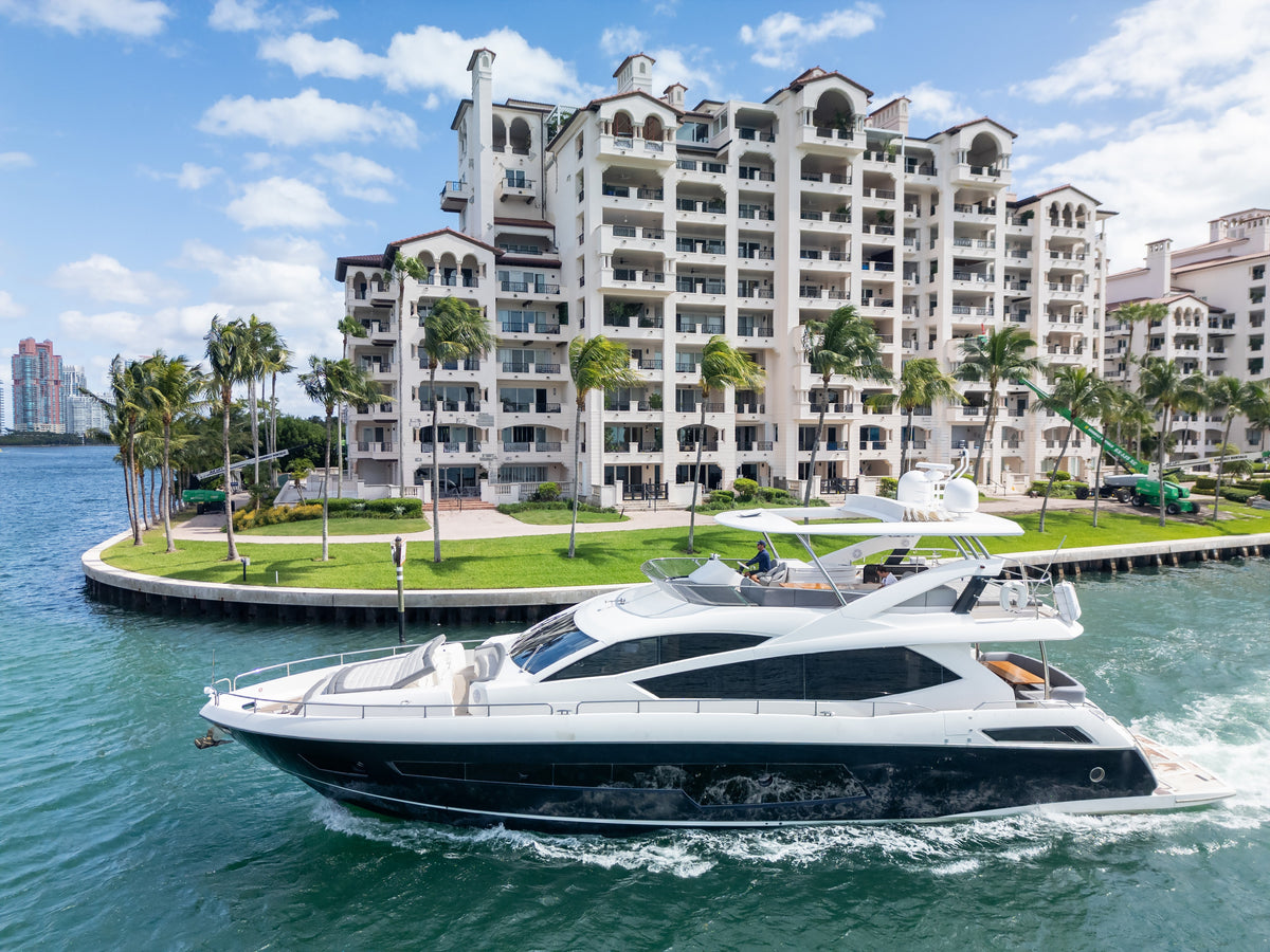 The 80ft Sunseeker START ME UP cruising past Fisher Island in Miami