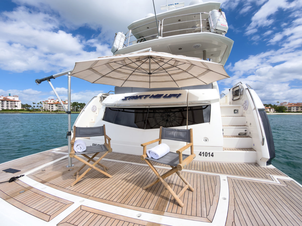 Aft deck of START ME UP set with director chairs and towels in Miami