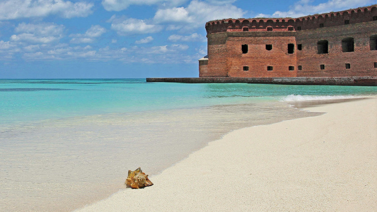 Pale sand and turquoise water beside Fort Jefferson, Dry Tortugas, Florida.