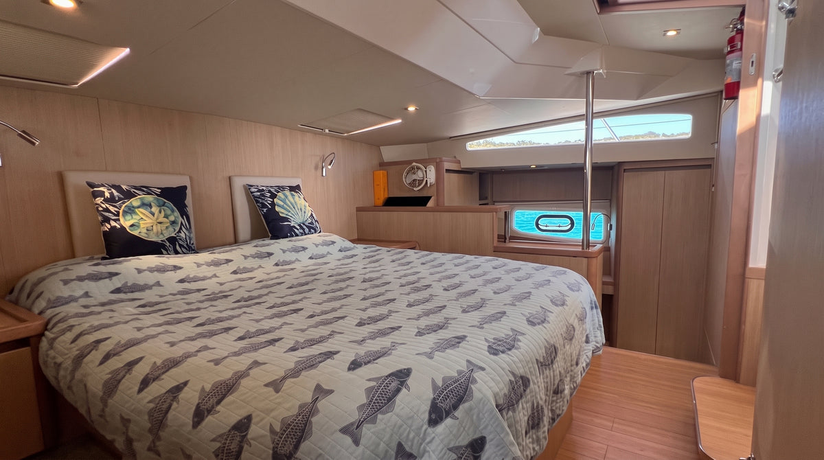 Double cabin with patterned bedding on Let it be 3, a 44ft Aquila catamaran