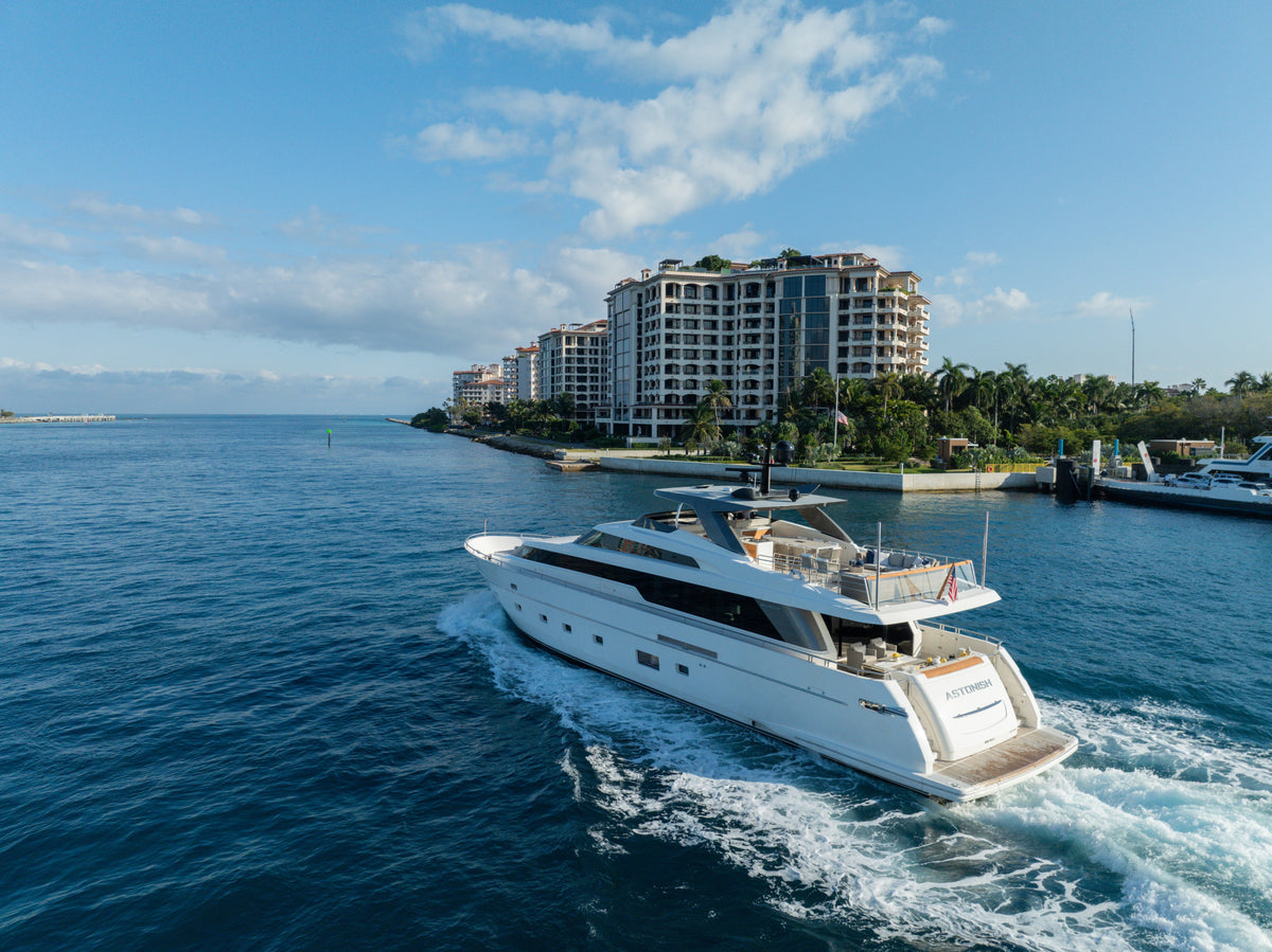 Aerial view of the 97ft Sanlorenzo ASTONISH underway off Miami Beach, white hull cutting a wake
