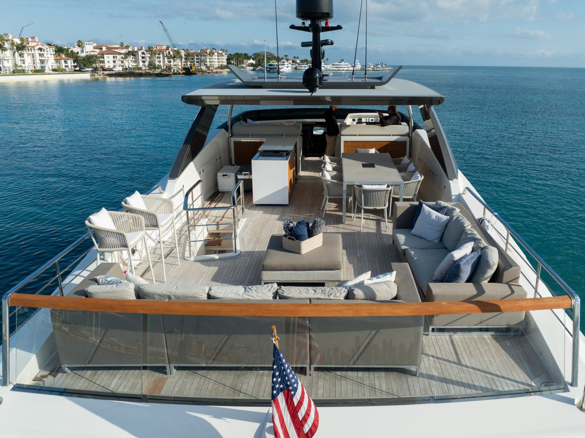 The flybridge of ASTONISH from above, sun loungers, dining table and upper helm ready for a Miami day