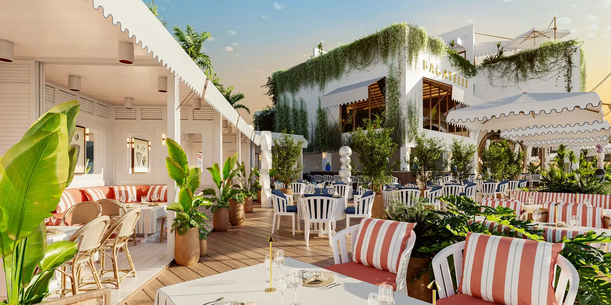 An outdoor restaurant patio scene with white tables, red-and-white striped cushions, potted plants, and a white building covered in green trailing vines under a warm blue sky.