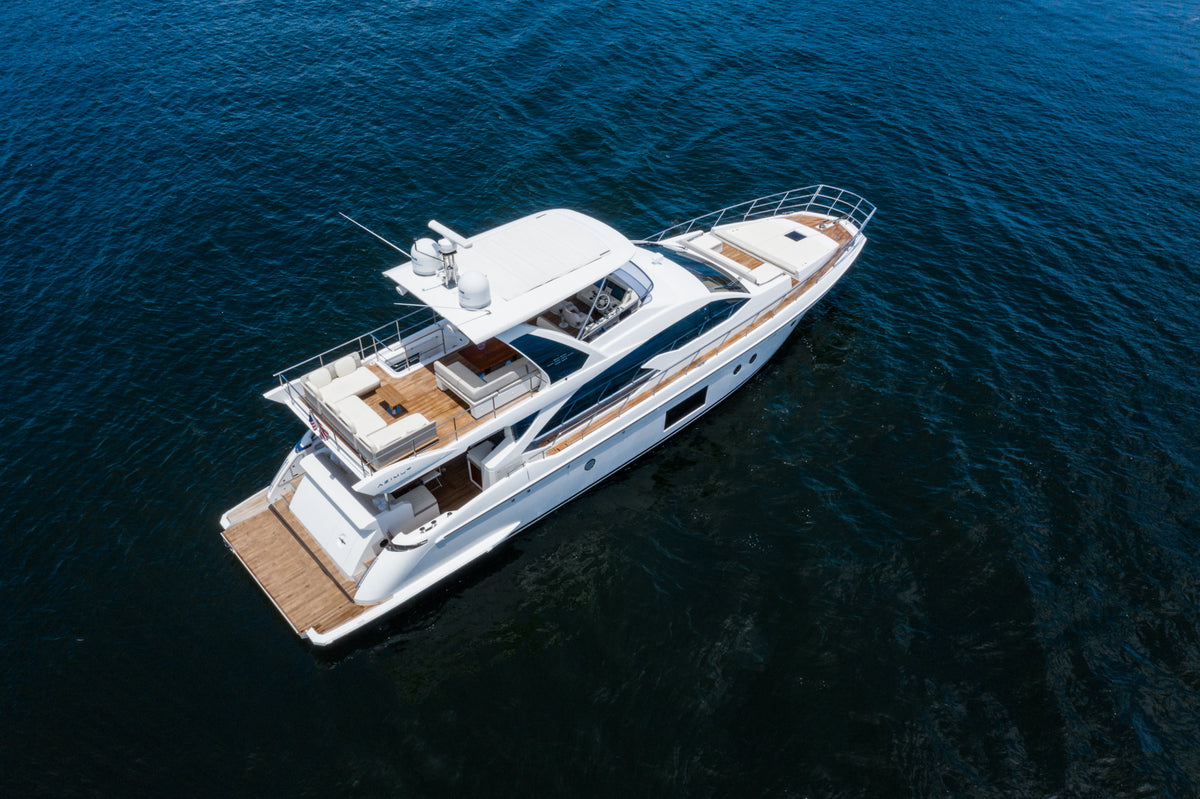 Le Grand Bleu 68ft Azimut seen from above, showing the flybridge and the teak aft deck