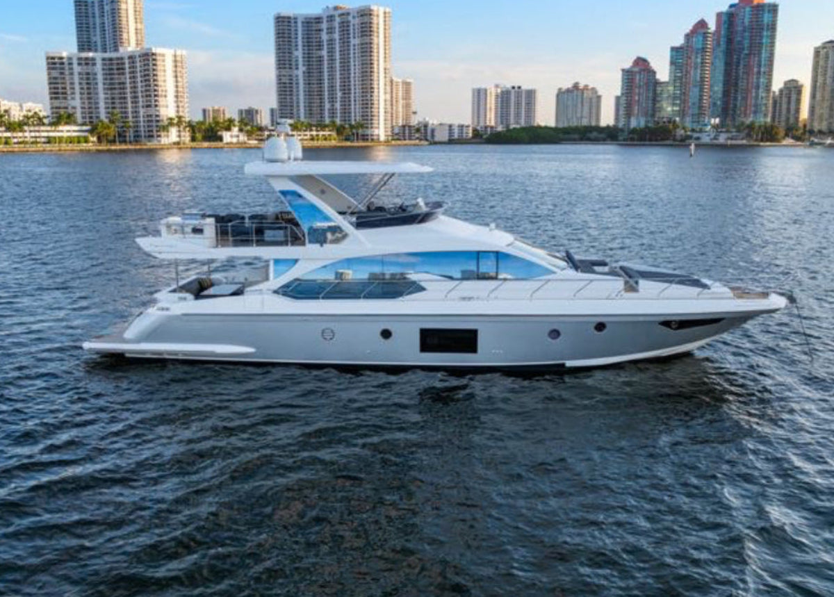 Paragon, a 68ft Azimut flybridge yacht, cruising off the Miami skyline