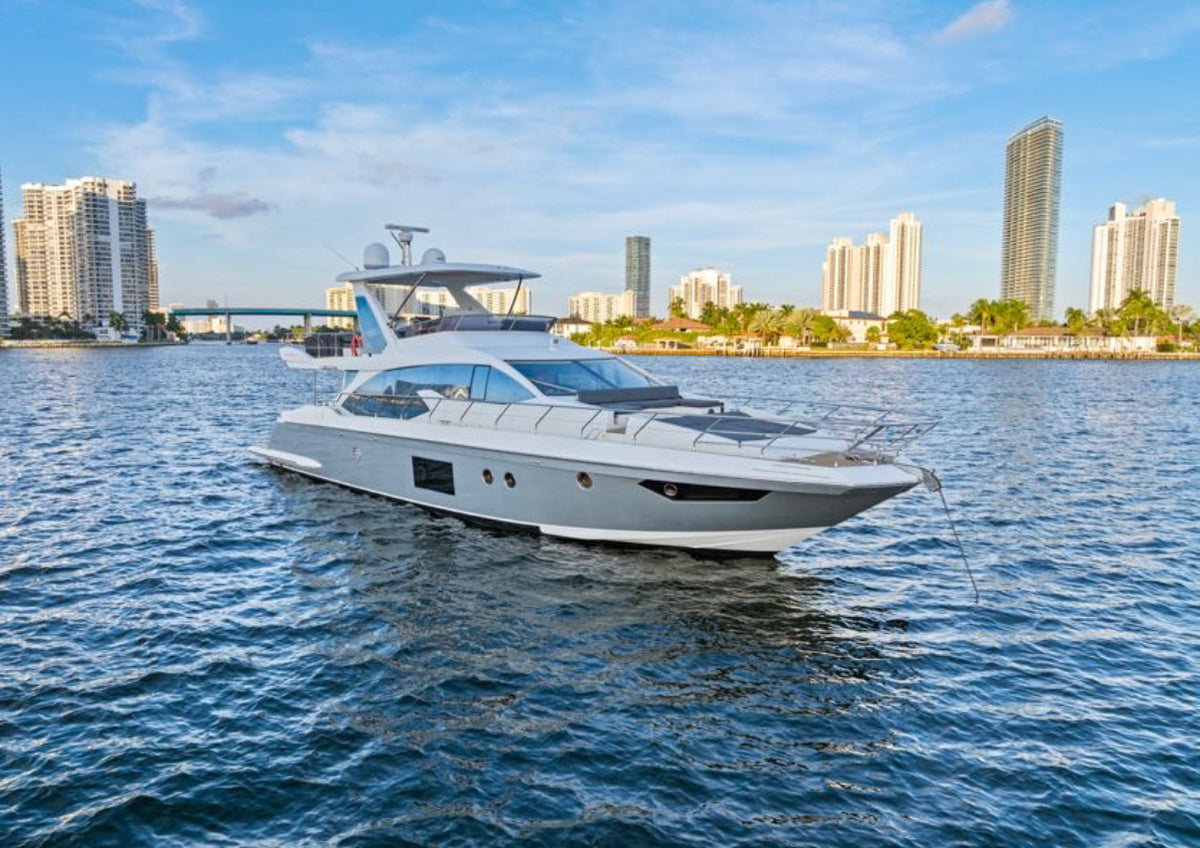 Paragon 68ft Azimut at anchor on Biscayne Bay with waterfront towers behind