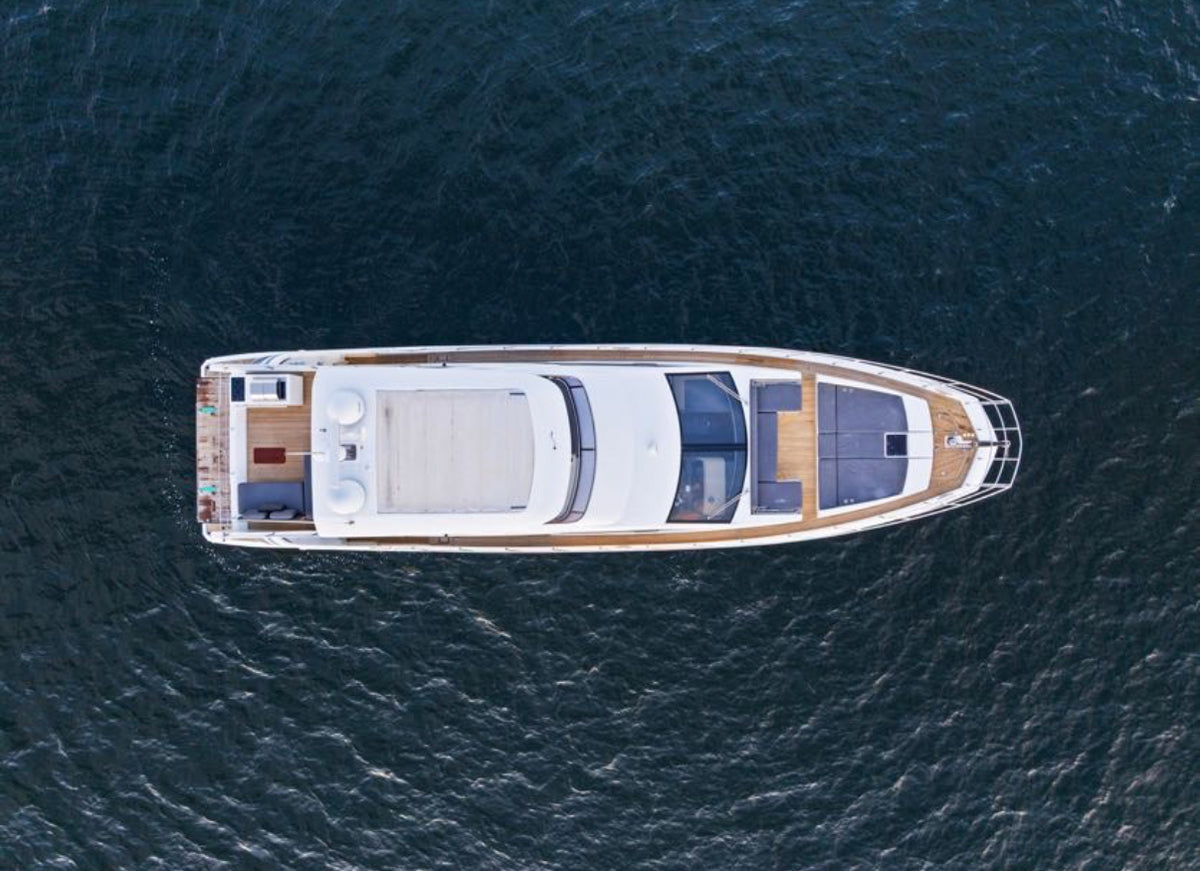 Top-down view of Paragon showing the flybridge, bow sun pads and teak aft deck