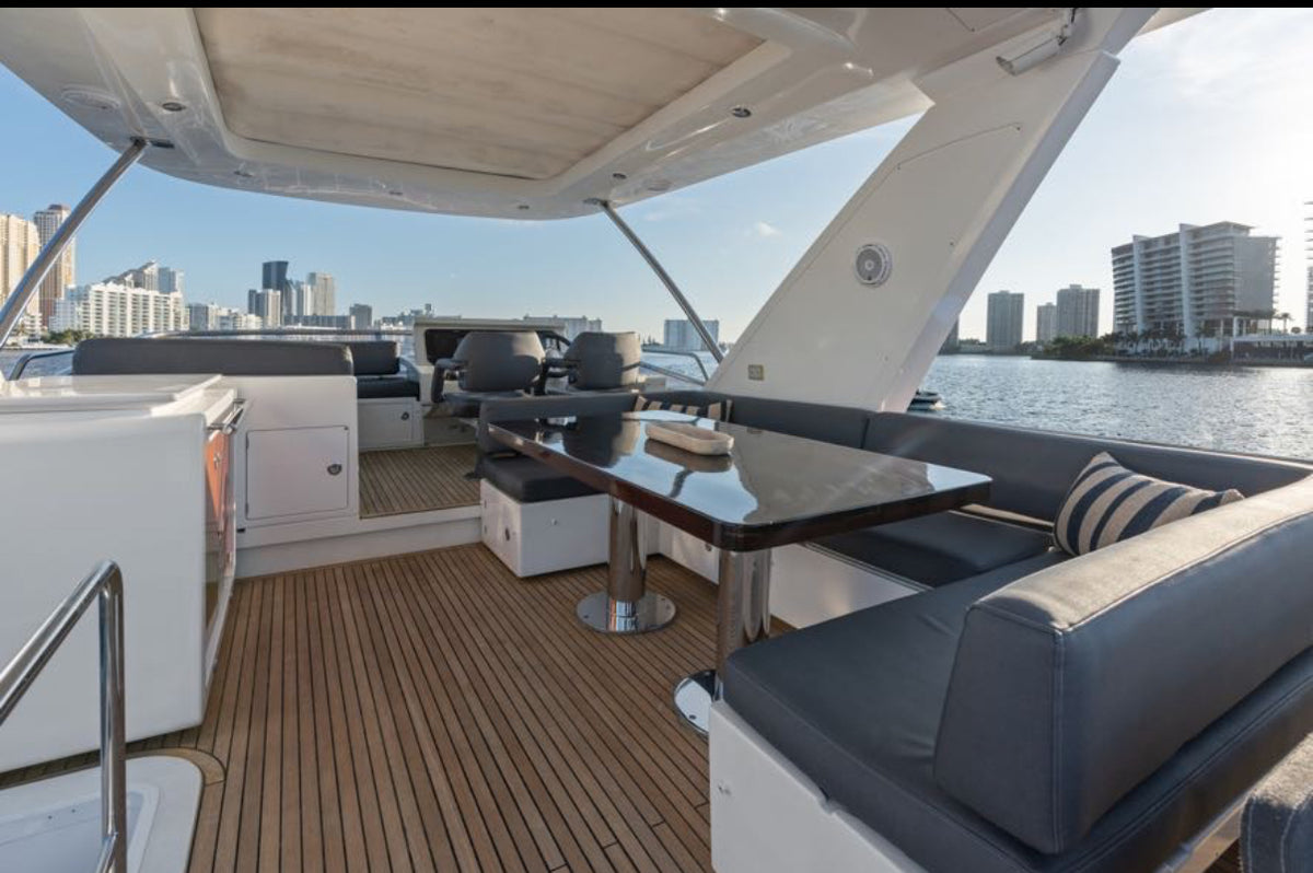 Paragon flybridge dining table with the upper helm just behind it