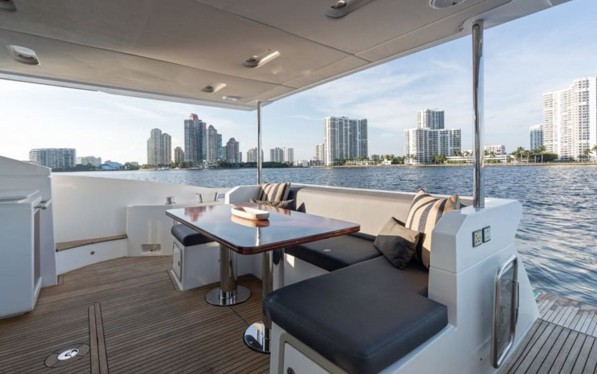 Covered aft deck dining on Paragon, steps from the swim platform