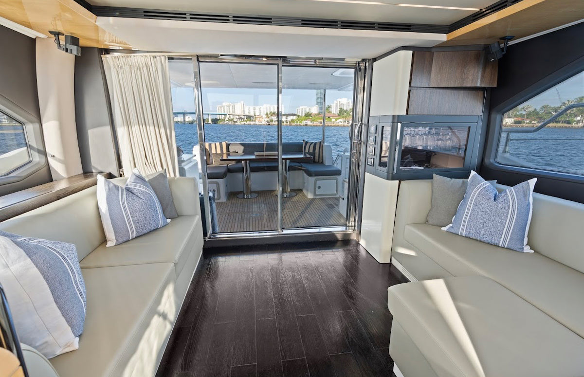 Main saloon on Paragon opening through glass doors to the aft deck