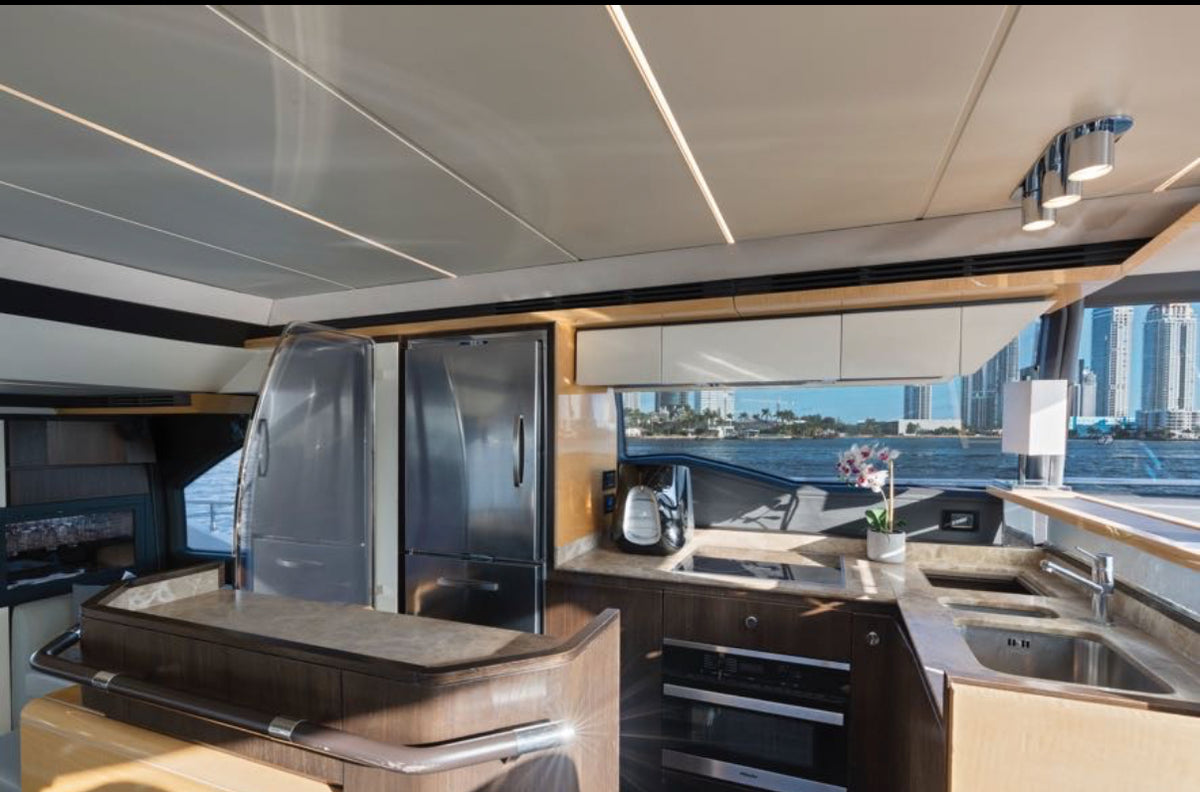 Modern galley on Paragon with full-size fridge, cooktop and bay views