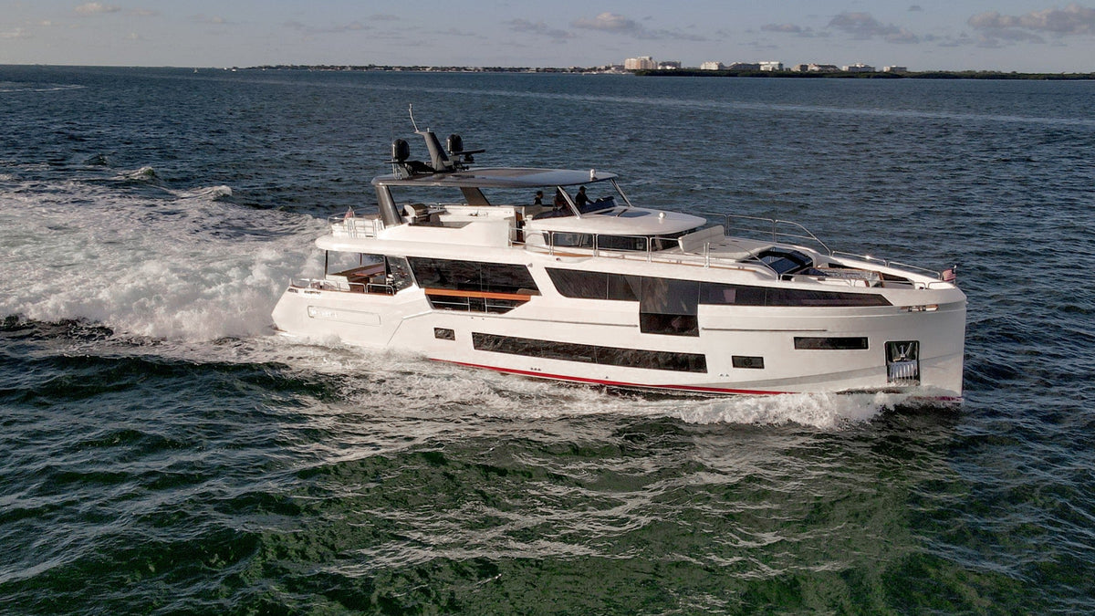 SAINT, an 88ft Sirena, seen from above under way on Miami's blue water