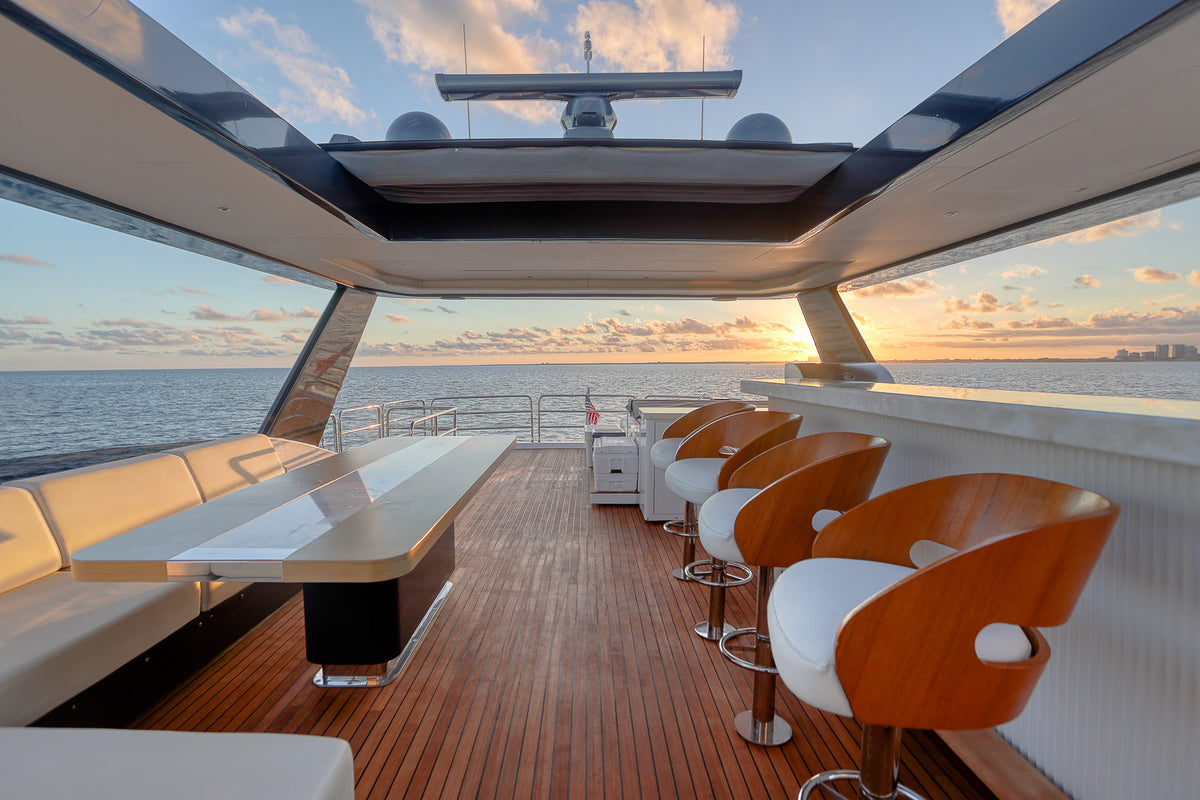 Flybridge lounge on the 88ft Sirena SAINT, long settee under shade