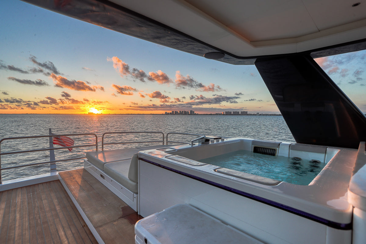 Jacuzzi set into the aft flybridge of the 88ft Sirena SAINT, open to the Miami sky