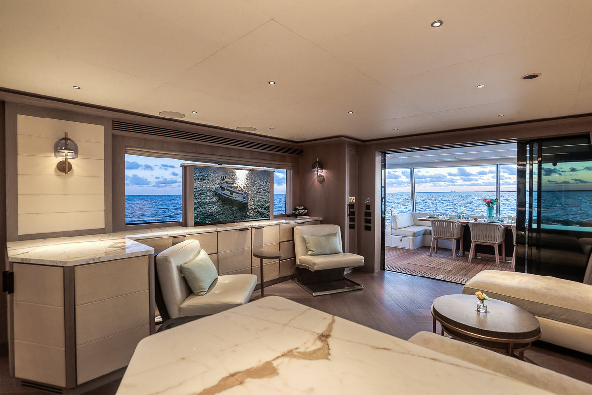 Saloon seating aboard SAINT, cream sofas and marble side tables