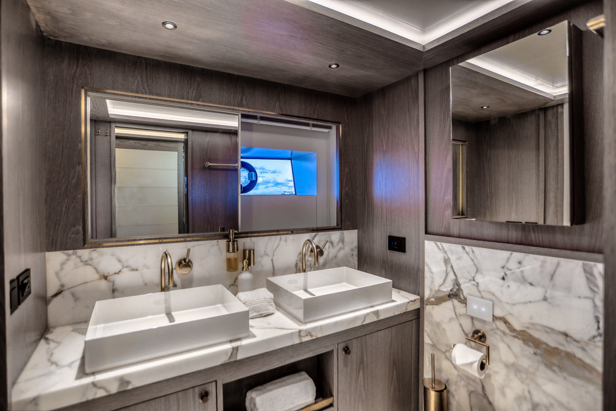 Guest bathroom on SAINT, compact marble finish for Miami day charters