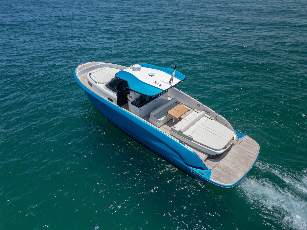 Solaris Power day boat running in open water with its wake trailing behind