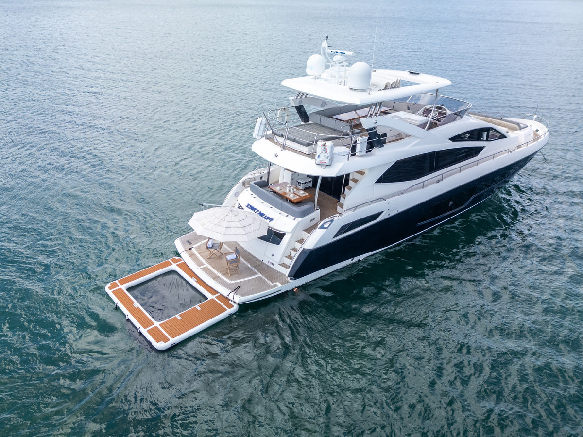 START ME UP, an 80ft Sunseeker yacht, seen from astern with her swim platform and floating pool