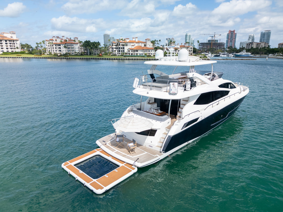 Floating pool and shaded deck chairs on the swim platform of START ME UP