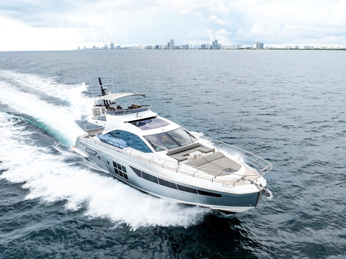 Aerial of Water You Doing showing the bow sun pads and flybridge hardtop