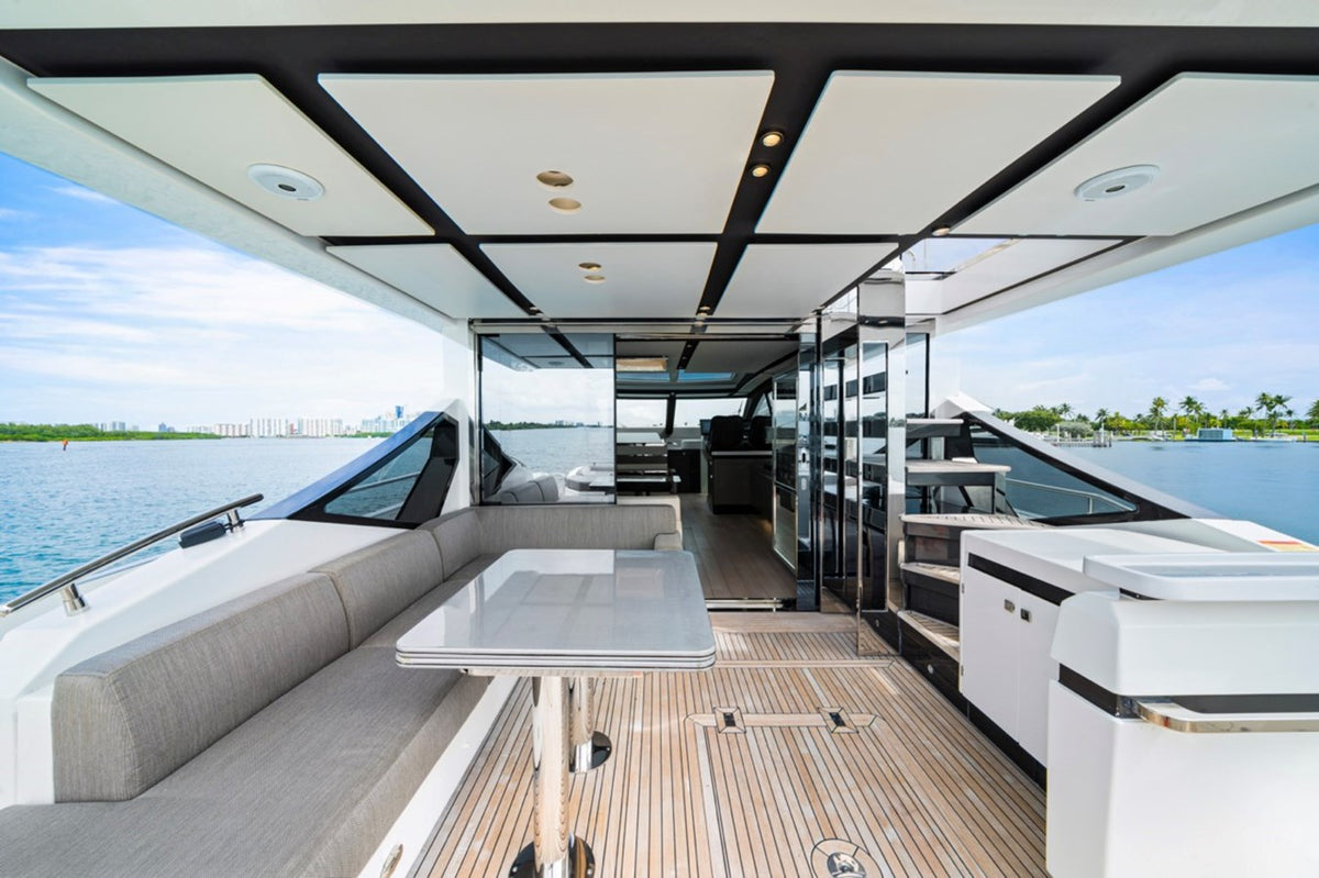 Covered cockpit dining table on the 72ft Azimut Water You Doing