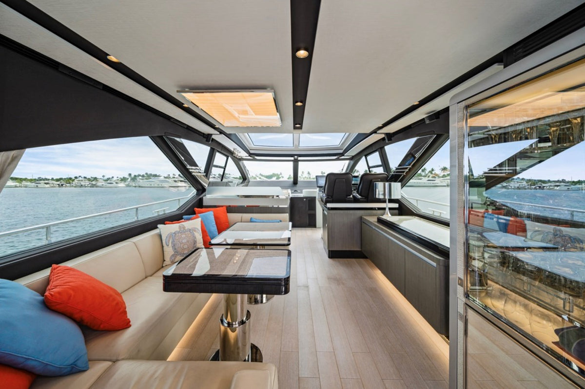 Saloon lounge and dining table on Water You Doing with wraparound windows