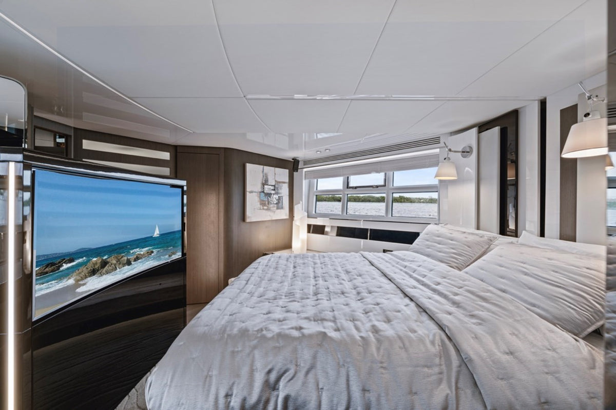 Stateroom on Water You Doing with wide hull windows and a flat-screen TV
