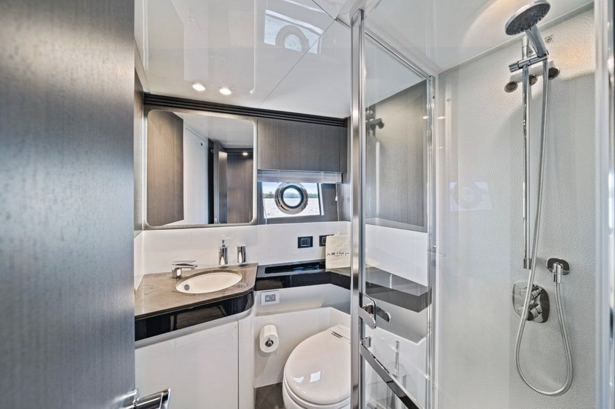 Bathroom on Water You Doing with a glass shower and porthole