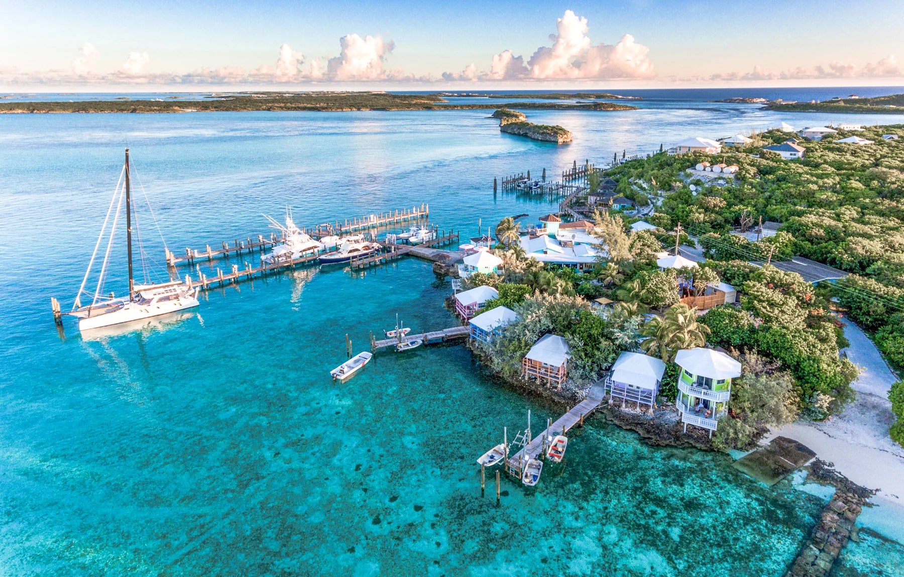 Aerial view of yachts, docks and colorful waterfront cottages at Staniel Cay in the Exumas, Bahamas.
